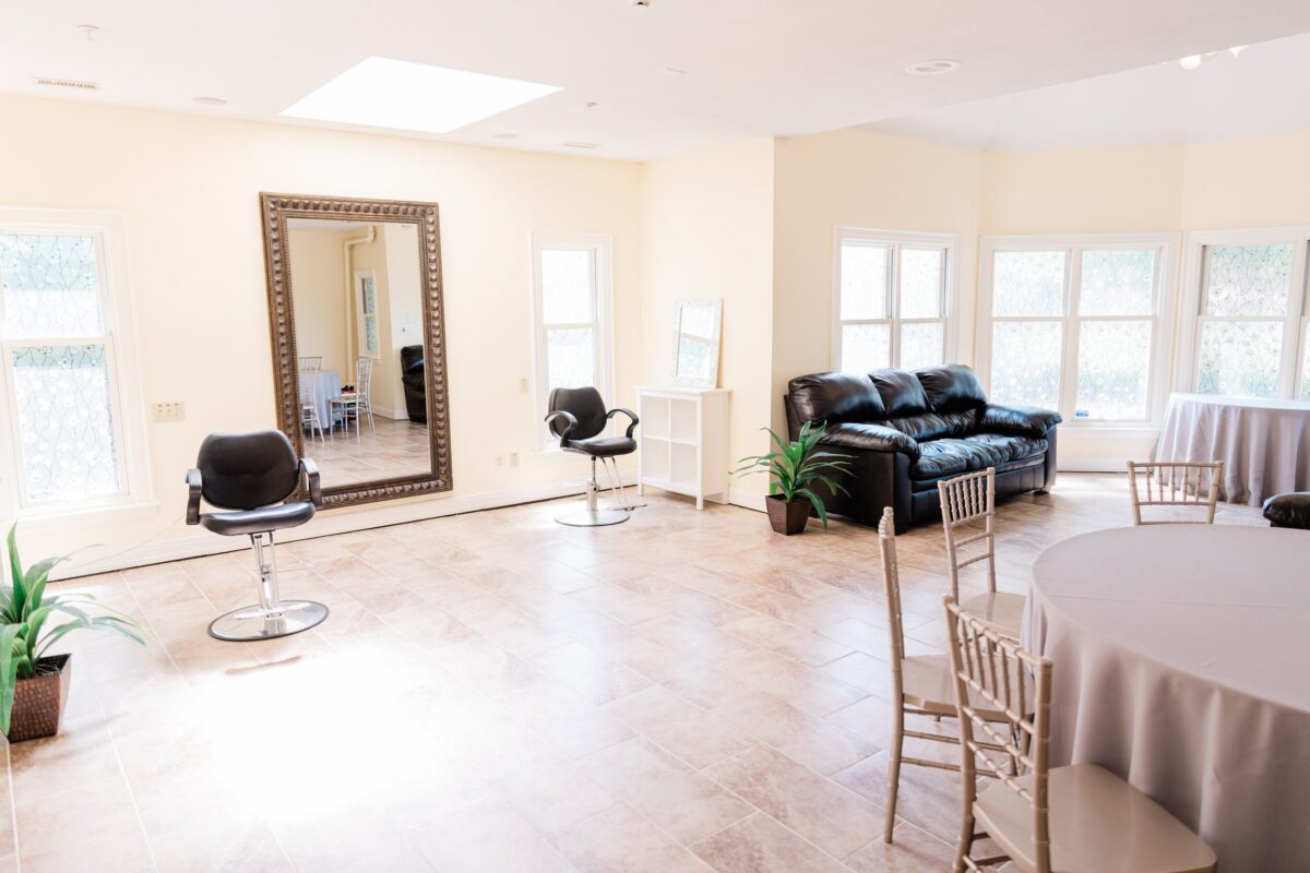 Bridal suite with salon chair and lounge seating at a Bellbrook, Ohio wedding venue